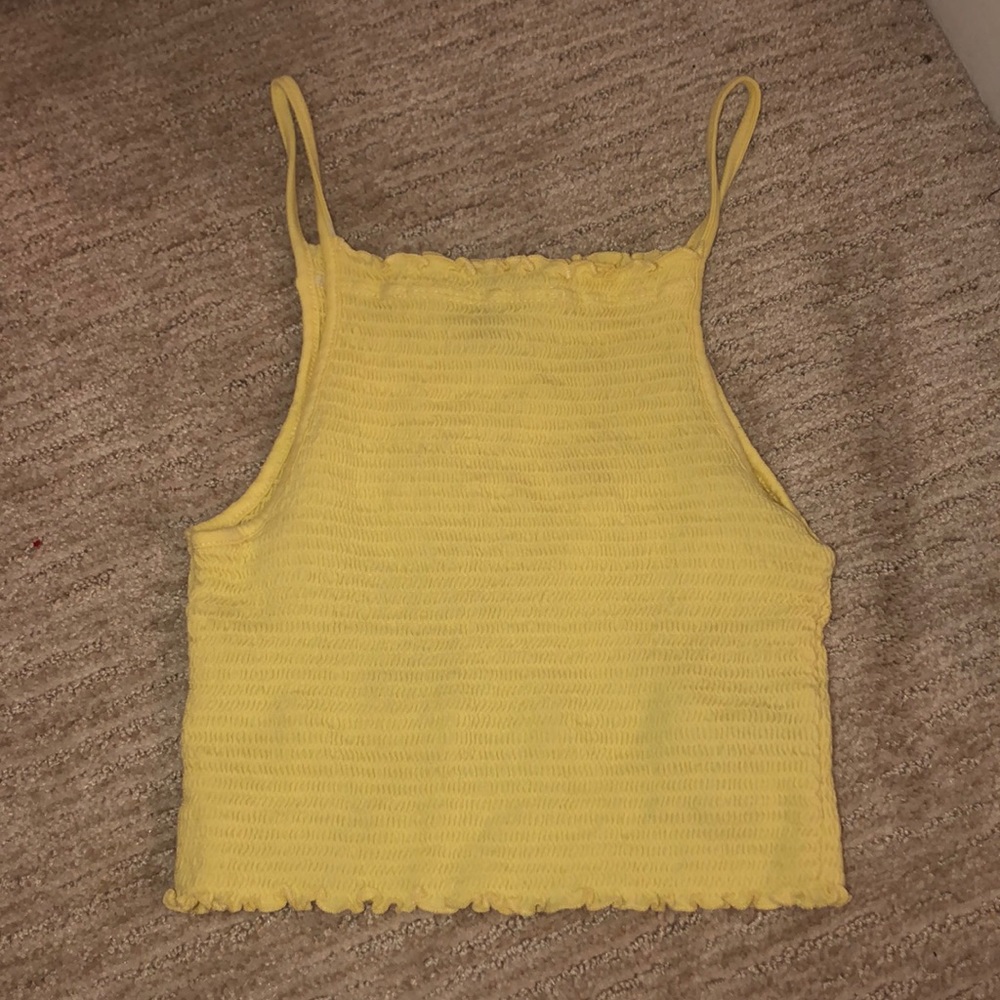 A yellow crop halter top